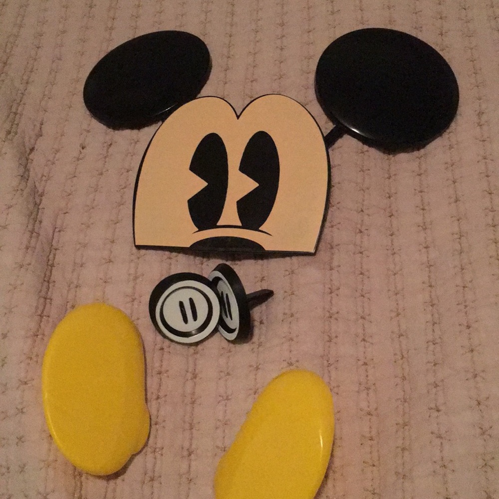 Mickey Mouse cake topper pieces.